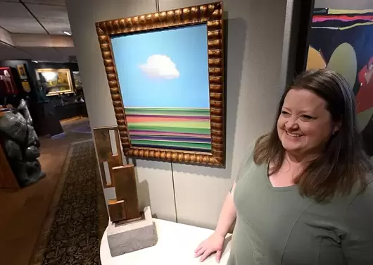 LOCAL NEWS Five Questions: Alyson Kinkade, a lifetime in the arts  Columbine Gallery closing June 1 By PAMELA JOHNSON  Loveland Reporter-Herald May 7, 2023 at 8:00 p.m.  ​  Alyson Kinkade has been creating art for, as she said, “as long as I can remember.” ​ The painter, who runs Columbine Gallery in Loveland with her dad, John Kinkade, is one of 62 artists with pieces in the Governor’s Art Show underway at the Loveland Museum, and dips her paintbrush into many different colors of the art world.  With the National Sculptor’s Guild, she helps place large sculptures in public art collections.  With the gallery, which is closing in June and transitioning to online only, she has provided a place for artists to display and sell their work, and for people to view a variety of different types of art. With her paints, she creates a unique world for people to enjoy.  1. How did you first start as an artist? What is your specialty? I have enjoyed creating art for as long as I can remember, with great art teachers throughout my primary schools in Greeley and Loveland, and a supportive family with creative friends even before my family started the art gallery. I grew up with encouragement to try all methods and materials that art can take form in, going to the Creative Arts Center all through elementary school.  …  My (junior high) art teacher was Dan Augenstein — we called him Auggie — who I later got to represent as an artist in our gallery. He’s also in the Governor’s Art Show. He specialized in ceramics at the time, so I created a series of ceramic animals that I then sold at Arts Picnic. Connie Einfalt and Laurie White were my art teachers at Loveland High and they were wonderful for exploring photography, sculpture and jewelry making, rare mediums to find at public schools. An enthusiastic art teacher makes a huge impact for a young creative and I’ve remained in contact with them. My junior year of high school I was fortunate enough to spend a summer at Interlochen Arts Camp, which helped me develop a portfolio to get a scholarship to attend the Kansas City Art Institute where I honed in on painting as my primary medium. Following graduation, I lived in Santa Fe where we had a second gallery at the time that I managed for a few years while also creating artwork; then returned to Loveland where I currently live, work and create.  My specialty is oil painting. I have a couple series right now, abstract landscapes and representational custom pet portraits. It’s nice to have the freeing intuitive work of the landscapes balanced by the tighter animal paintings. I love doing both.  2. What is your inspiration, in life and in art? I am inspired by nature. I love to visually take in the expansive plains of Colorado with ever changing skies. I’m equally inspired by animals and helping groups who advocate for them. Proceeds from my ‘Happiness Is’ pet portrait series help me contribute to animal welfare organizations. I love to give back through my art. The use of stacked colors in my landscape paintings represent one’s goals and ambitions laid out before them; and the sky is the space to contemplate new ideas. The horizon is where dreams and aspirations meet.  3. Describe the Governor’s Art Show. What makes it special? What is the draw for residents? I am very proud to be juried in for my 10th time. It is wonderful to be part of such a unique show that gives back to the community through its sales. The 32nd Colorado Governor’s Art Show and Sale is one of the largest juried fine art shows in the state. It runs through June 11th at the Loveland Museum. …  What makes it so special is that it is truly is an “Art with Heart” exhibit, the show benefits Loveland and Thompson Valley Rotary Clubs’ charitable projects and causes. One-third of the proceeds go to the Thompson Education Foundation’s Homeless Assistance Fund and additional funds go toward scholarships for local art students. Scholarship winners have a piece displayed in the show on the back wall. I have met them, and they are impressive young people with bright futures.  Since 2016, the Governor’s Art Show has had different jurors every year, and that makes each show so distinctive and shows off new artists purely by the aesthetic value of who juried. This makes the show fresh, diverse, and full of what Colorado artists are currently expressing. There are 62 artists on display. You will discover artists from all corners of the state, and there is something for everyone. … The caliber of artists in the show is unmatched. (https://governorsartshow.org)  ​4. What is the history of Columbine Gallery? I understand that the physical gallery will be closing. Why and what are the plans for transitioning online? What will become of the building? Yes, this is our final month of being open to the public as Columbine Gallery. … My father (John Kinkade) founded the National Sculptors’ Guild in 1992 with a dozen sculptors who wished to find thoughtful public applications for their work. JK Designs is the design team that promotes and provides consultation for the Guild. Columbine Gallery was opened as a space to show the artwork by members of the National Sculptors’ Guild when cities and companies would come out to meet on large-scale commissions. We started out in a small space at 1032 Lincoln Ave. The gallery walls were used to showcase regional painters, and after moving to our current location 2683 N. Taft Ave., Columbine grew into one of Northern Colorado’s largest fine art galleries housing over 50 artists at one time, and the adjacent National Sculptors’ Guild Sculpture Garden filled with 85-100 sculptures year-round.  After 30 years, we have elected to refocus our time and energy on the National Sculptors’ Guild and placing large-scale artwork in commercial and public spaces. Many Lovelanders may be unaware that we have a full-scale public art business, placing over 550 significant monuments across the nation over the years. While we have thoroughly enjoyed working with art appreciators of all levels, the true passion has always been in the design team approach it takes to place great public art. That is how we started, and we are feeling it is time to devote ourselves to the Guild once again.  We will continue to sell much of the artwork online, (nationalsculptorsguild.com), which has become a popular choice among art collectors.  …  This transition to less show space also allows me to pursue more opportunities for my own artwork, and my father can continue to work on his philanthropic projects that often combine the arts and helping community. It has been a privilege to serve the community of Loveland and our amazing stable of artists over the years. We look forward to continuing to do so in a different capacity.  We are thrilled to see someone new take the space with new energy and ideas to make their own mark on this special art-filled city. The Taft Avenue gallery and garden will continue to showcase art as the new owner is currently working to open ‘par-a-dox fine arts’ this summer. There will be different artists and events that will renew the space with creative energy. It feels good that our legacy will continue in this way.  5. What are your favorite places to enjoy art in Loveland? Columbine Gallery and Garden (through May), Benson Sculpture Garden, Loveland Museum, Artworks, Artspace, Downtown Loveland (rotating sculptures and the growing mural collection) some of the local restaurants have fun rotating artwork (Muse, Verboten, Henry’s, West End) and occasionally I grab a blizzard at the Dairy Queen and enjoy seeing sculptures on loan there too. Loveland is full of great art and artists everywhere you go.  Bonus: What advice would you give to aspiring artists? Dream big, put in the hours, seek out those who support your efforts, and give back when you can.  Alyson Kinkade Years in Loveland: 26 Occupation: Artist, Director at Columbine Gallery and the National Sculptors' Guild  Pamela Johnson | Assistant Editor Pamela Johnson is an award-winning journalist with two decades invested in the community of Loveland. She covers education, county government, environmental issues, outdoor recreation and whatever else she finds along the way. johnsonp@reporter-herald.com  Follow Pamela Johnson @RHPamelaJ
